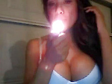 This Fake-Boobed Bimbo Loves To Smoke Slim Cigarettes