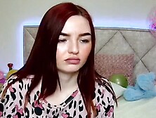 Cute redhead babe chats on webcam