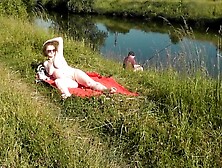 Riverside undressed mother i'd like to fuck sunbathing is not shy about random fisher.  Outdoors.  Wild beach.  Public nudity Porn