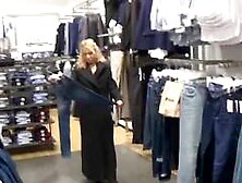 Big-Titted Blonde Fingers Herself In A Public Changing Room