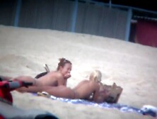 Beach Spy Captures Two Friends Sunbathing Topless