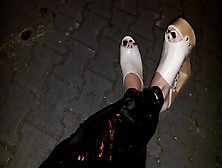 Crossdresser On The Street In Latex Leggings And High Heels