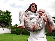 Busty Tattooed Brunette Devours A Muscular Stud's Cock