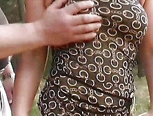 A horny brunette babe from Germany gets banged in the woods by two hard cocks