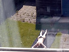 Sunbathing (Partly Topless)