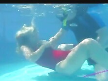 A Woman In A Red Swimsuit Is Drowning