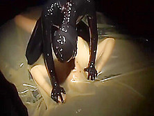 2 Cute Lesbians Full Encased In Latex Suits Have Fun In Her Rubber Skins And Vacuum Bed - Part Two