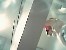 Woman flashes perky boobs in the changing room