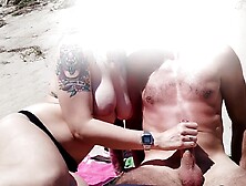 Real GF gives public beach handjob leading to cumshot - close call!