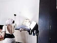 The sexy wife is having fun testing clothes and cuts them.  The brunette dances naked around the house.